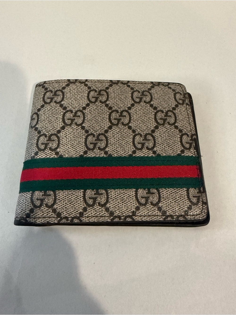 GUCCI Brown GG Supreme Canvas Bifold Wallet Pre-owned.